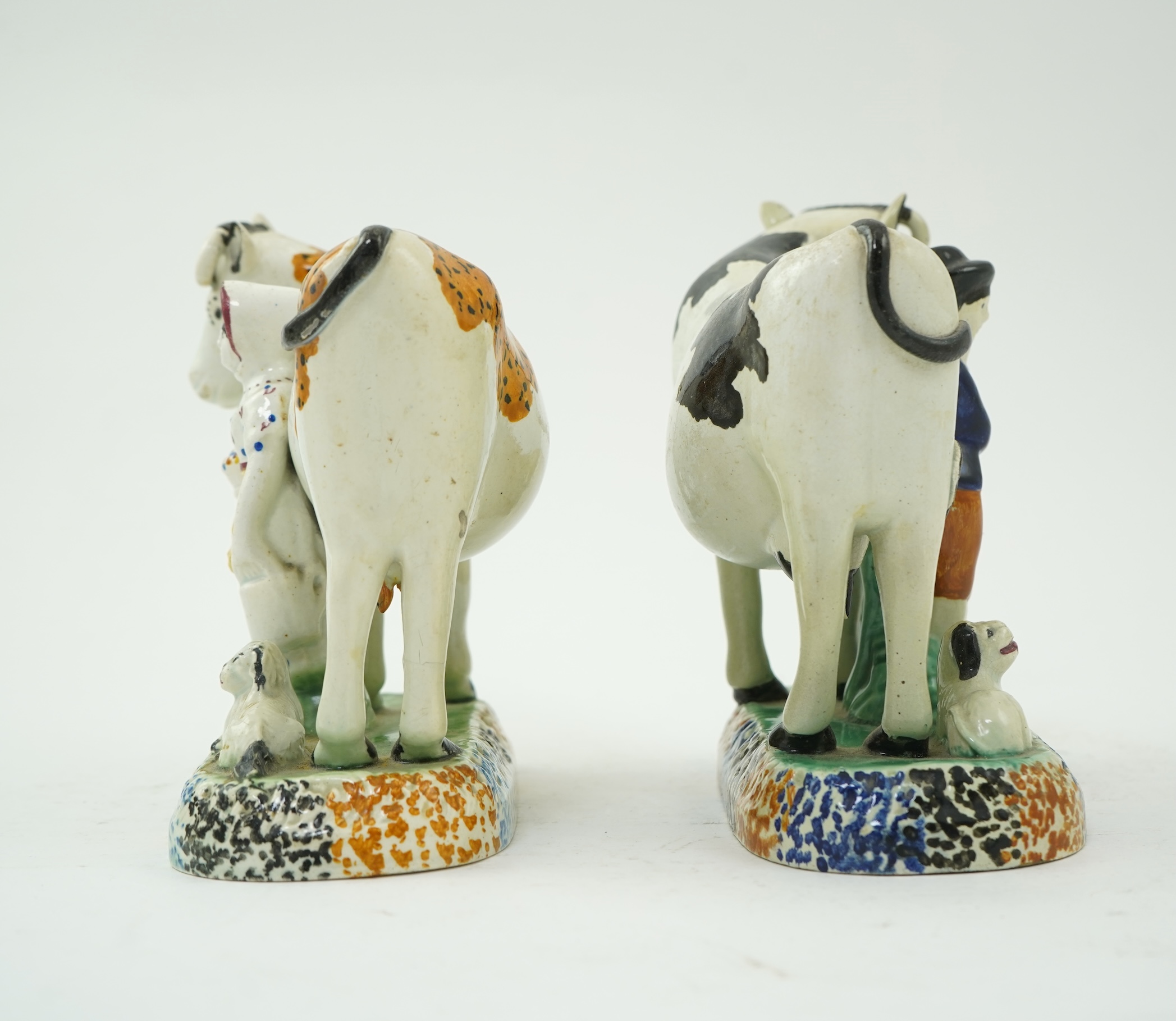 Two Yorkshire Prattware cows, with farmer or milkmaid and dog groups, c.1810
